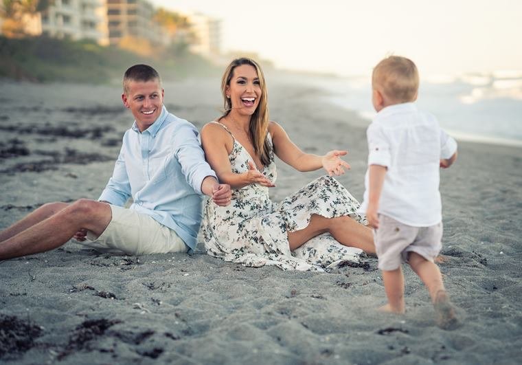 Family playing in the sand