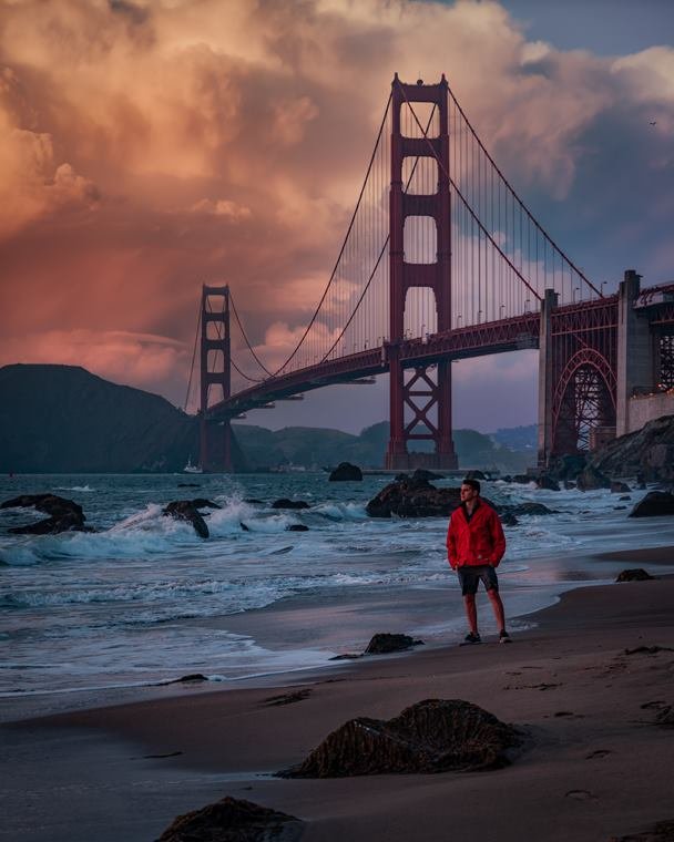 Red jacket portrait beneath the Golden Gate Bridge
