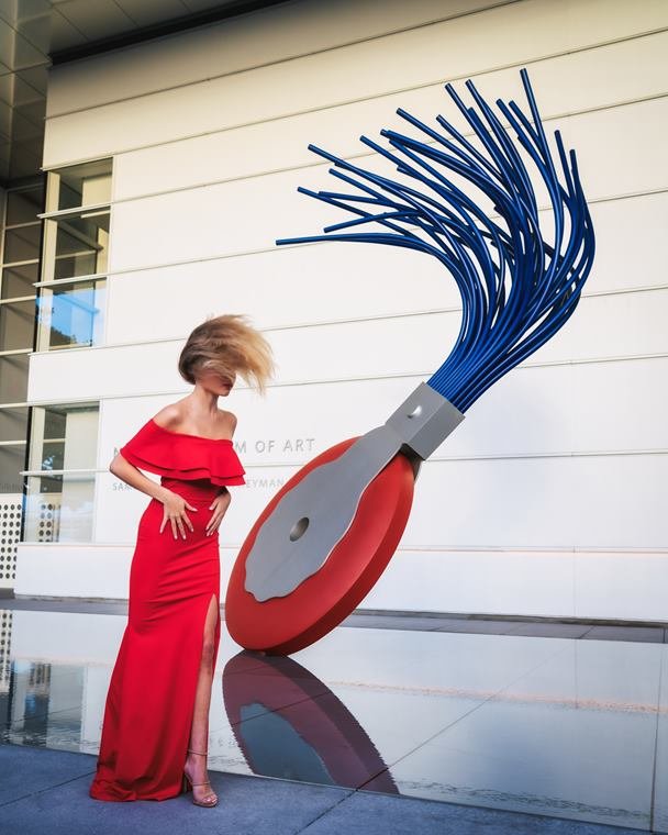 Red dress at the museum sculpture