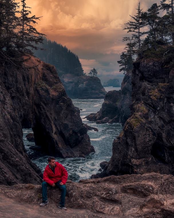 Portrait seated above the sea cliffs of the Oregon coast